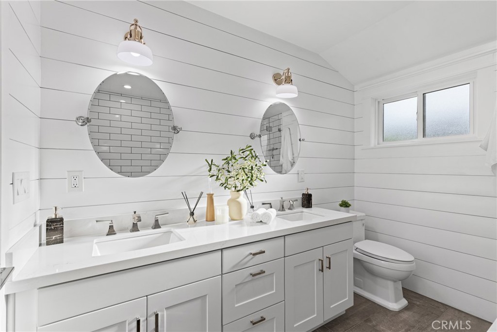 12947 La Maida Street Sherman Oaks, CA 91423 - Photo 18 of 31 a bathroom with a toilet a sink and mirror