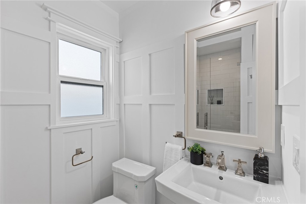 12947 La Maida Street Sherman Oaks, CA 91423 - Photo 21 of 31 a bathroom with a sink a toilet and shower