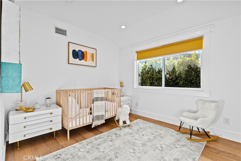 12947 La Maida Street Sherman Oaks, CA 91423 - Photo 22 of 31 a bedroom with a bed and a window