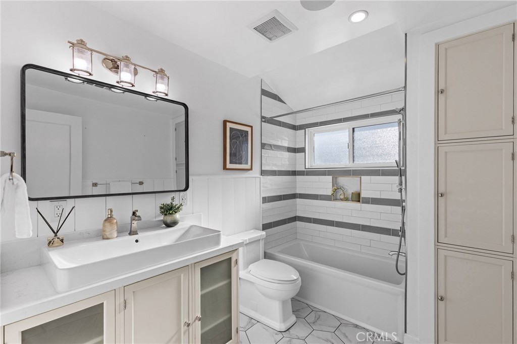 12947 La Maida Street Sherman Oaks, CA 91423 - Photo 23 of 31 a bathroom with a sink toilet and shower