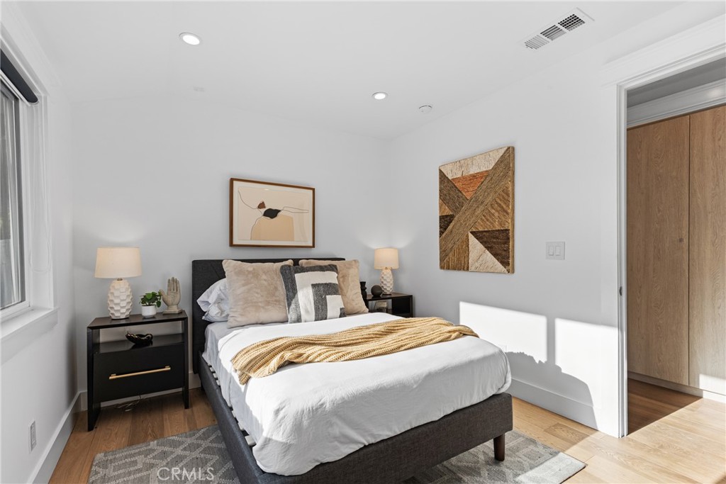 12947 La Maida Street Sherman Oaks, CA 91423 - Photo 24 of 31 a bedroom with bed and painting on the wall