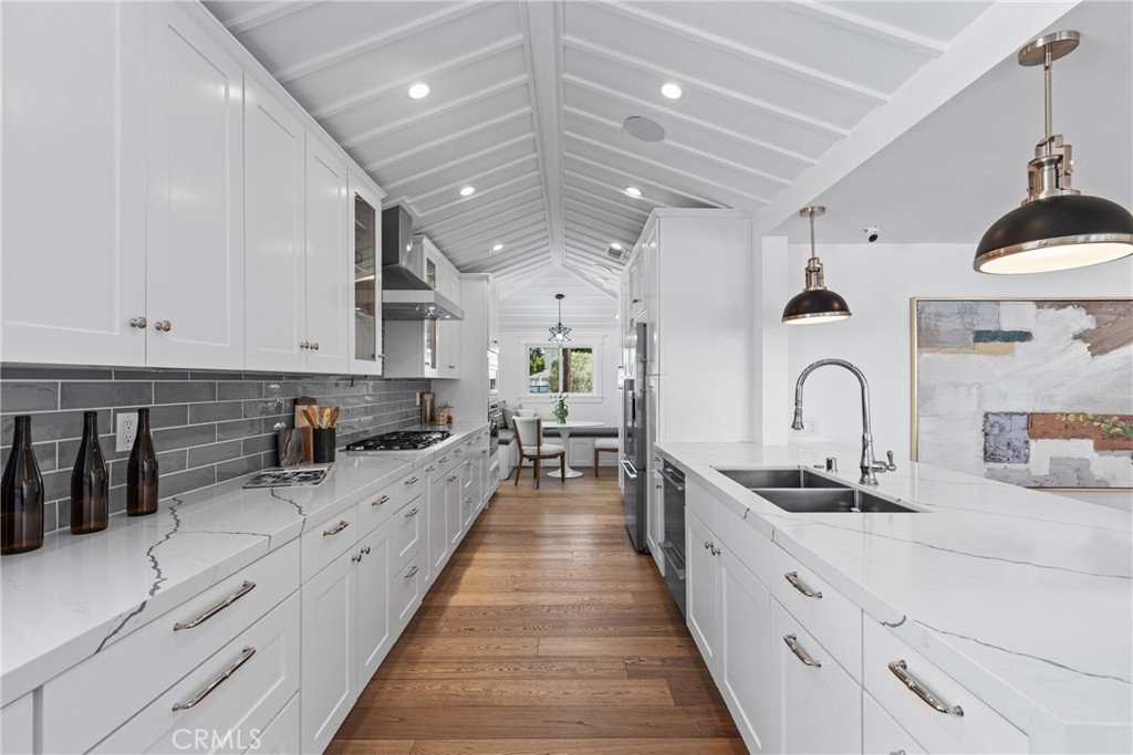 12947 La Maida Street Sherman Oaks, CA 91423 - Photo 4 of 31 a large kitchen with stainless steel appliances lots of counter space and a sink
