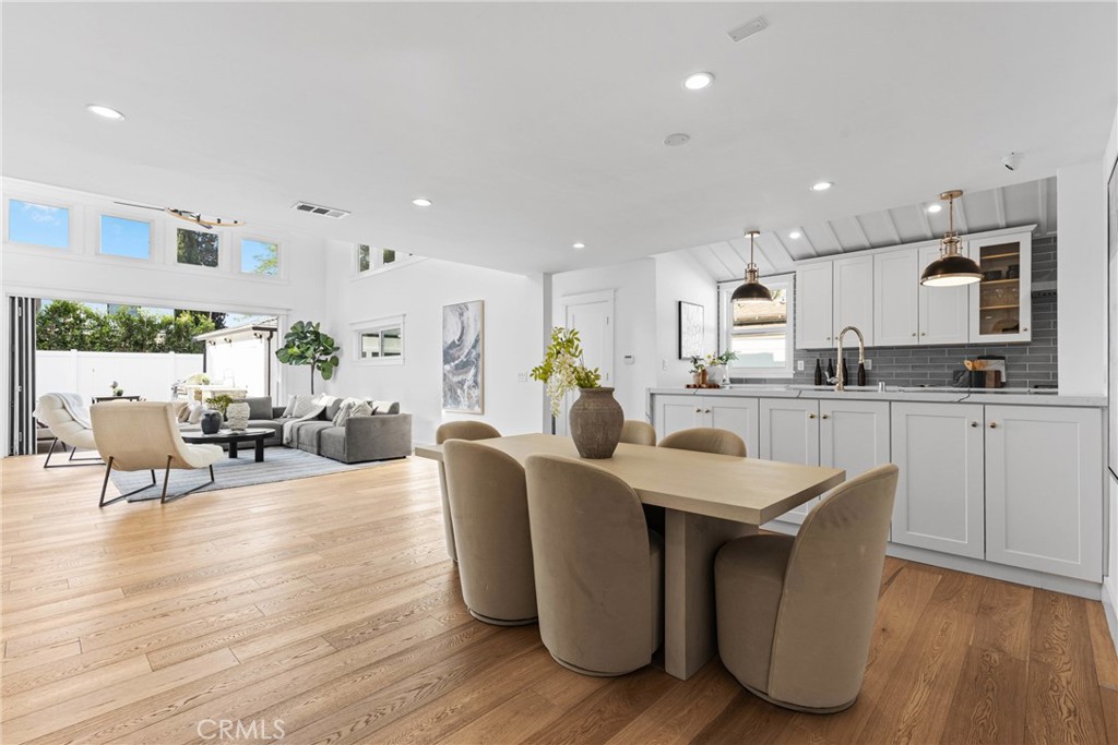 12947 La Maida Street Sherman Oaks, CA 91423 - Photo 5 of 31 a living room with kitchen island furniture and a wooden floor