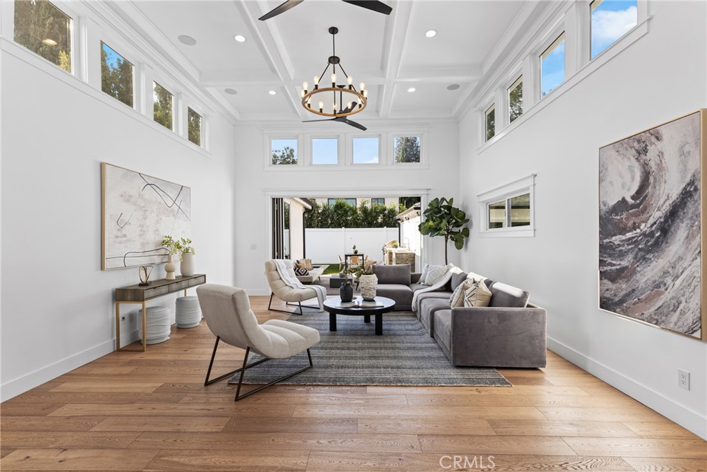 12947 La Maida Street Sherman Oaks, CA 91423 - Photo 9 of 31 a living room with fireplace furniture and a large window