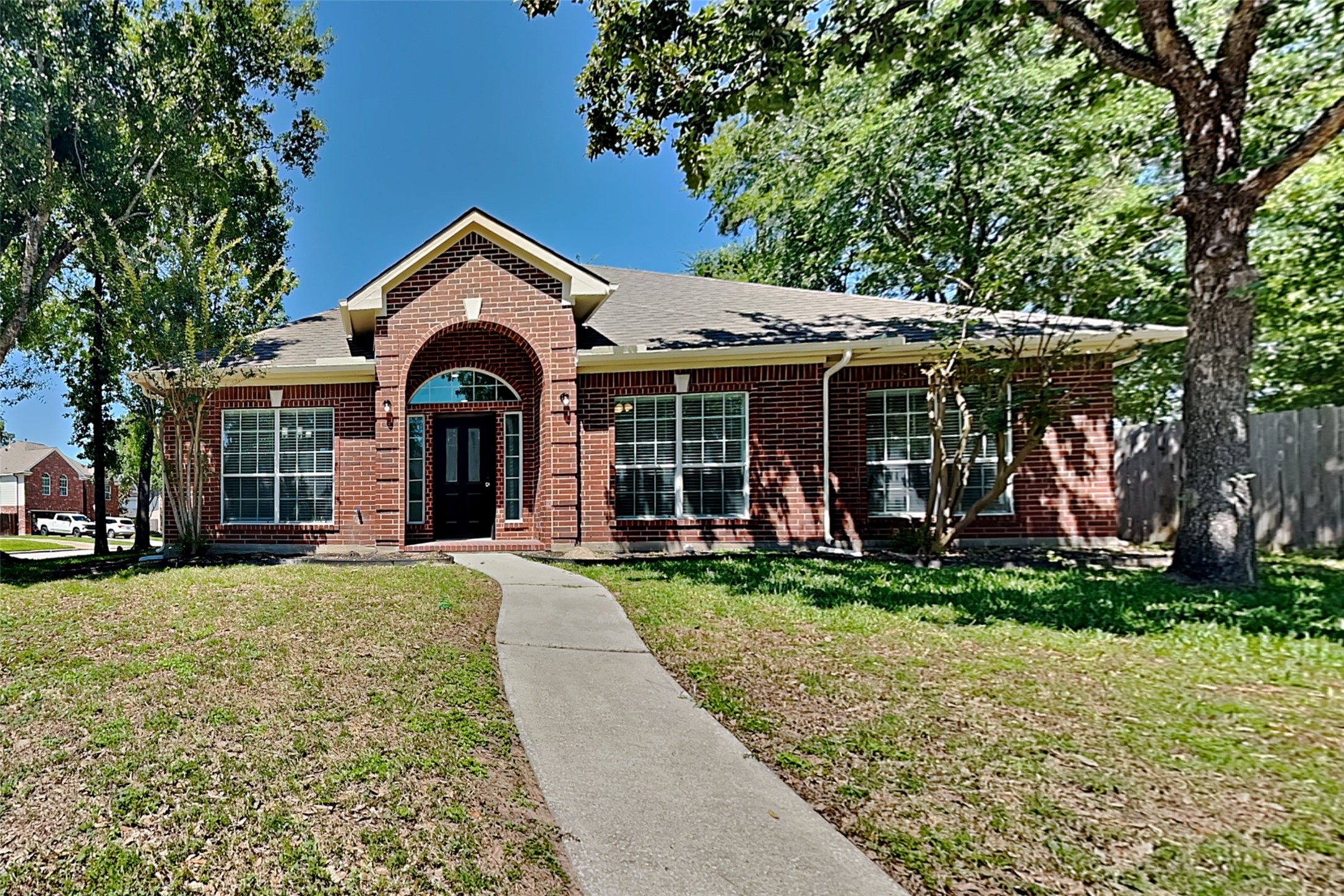 8615 Mile Run Road Humble, TX 77346 - Photo 1 of 19 a view of a house with next to a yard