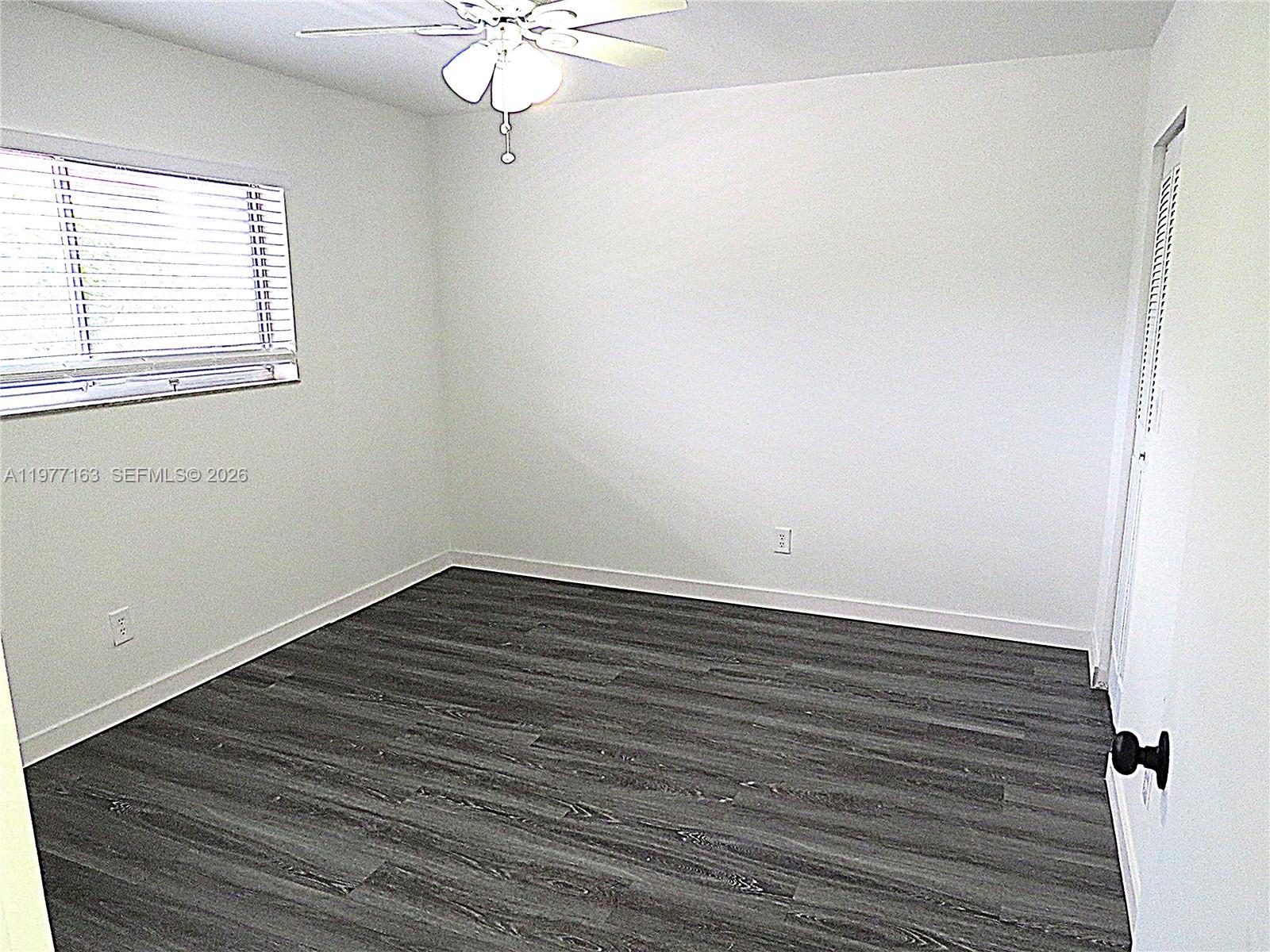 3591 Inverrary Drive, Unit 203 Lauderhill, FL 33319 - Photo 5 of 12 wooden floor in an empty room