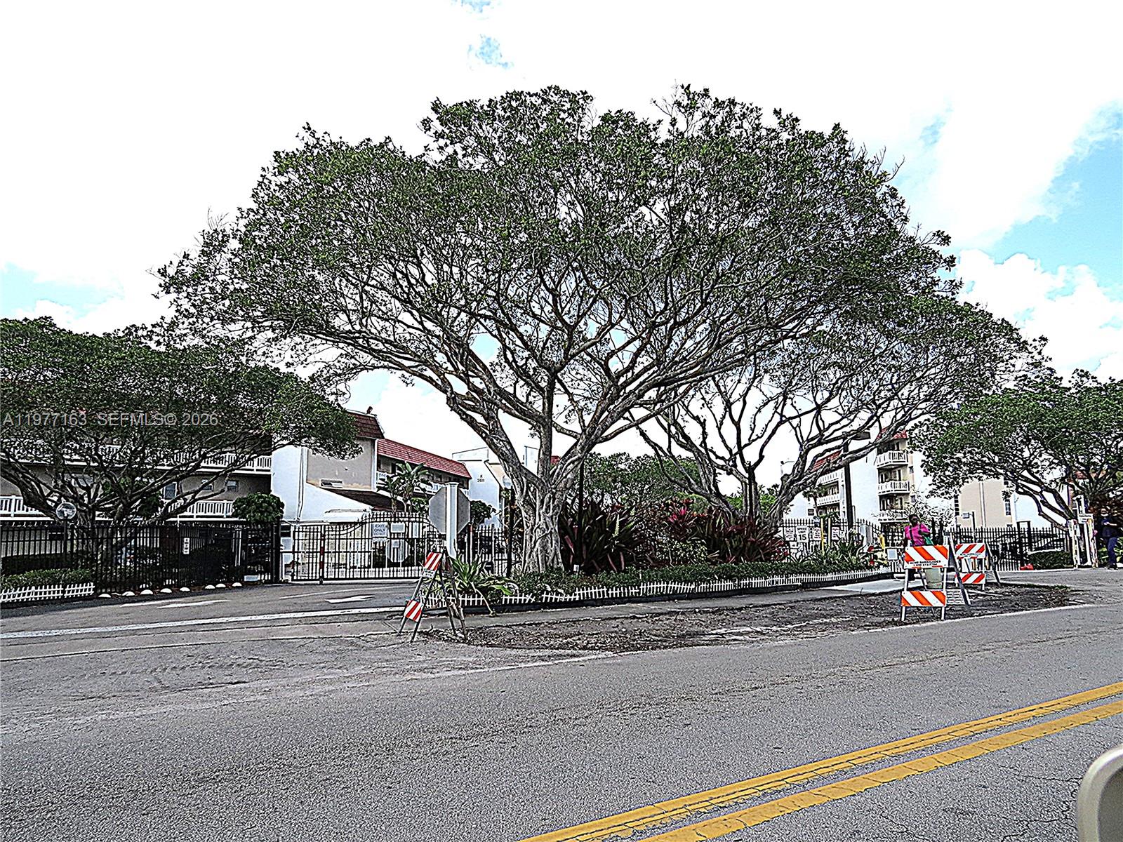 3591 Inverrary Drive, Unit 203 Lauderhill, FL 33319 - Photo 9 of 12 a cars parked on the side of the street