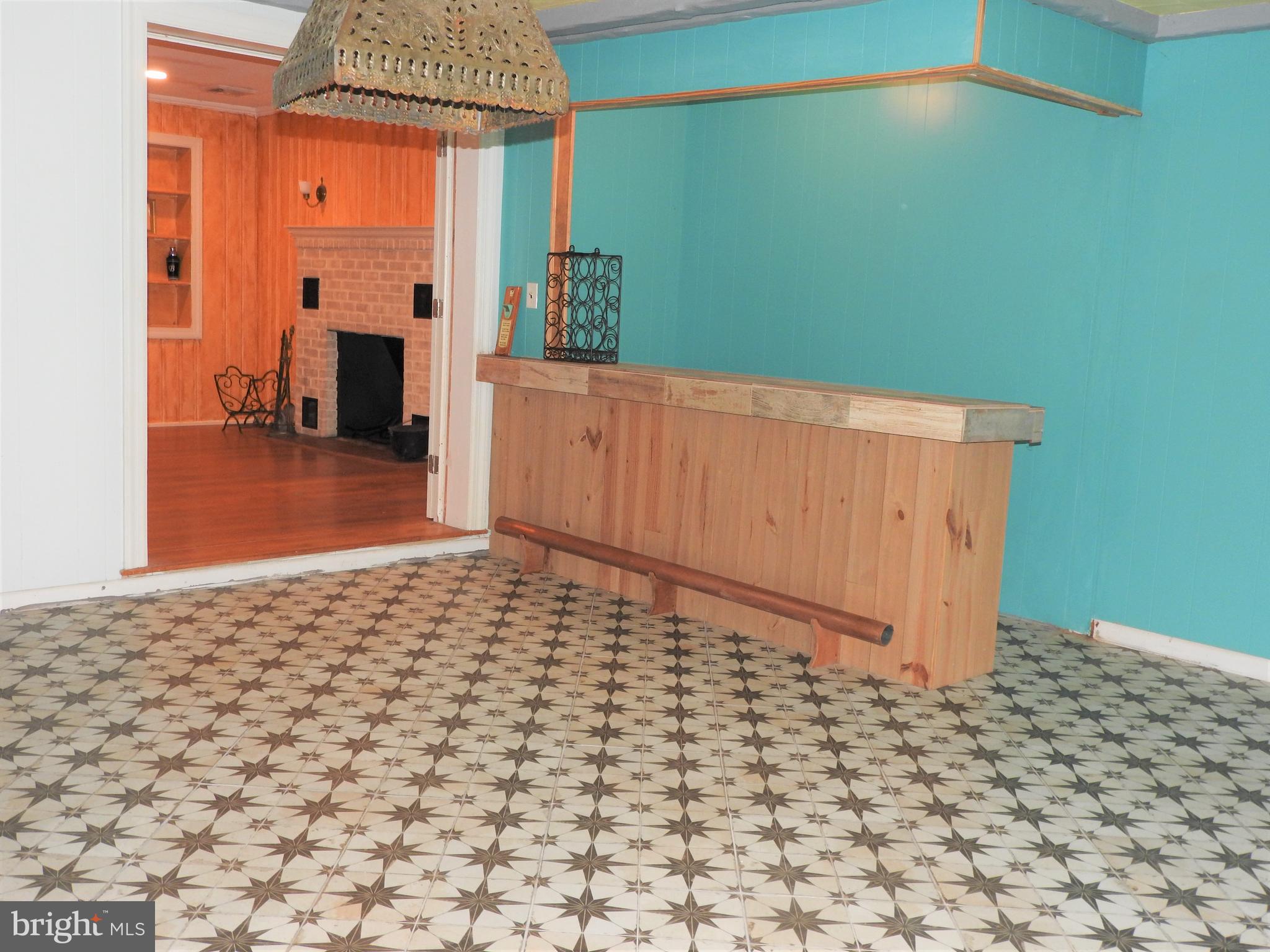 101 Sandy Hill Road Cambridge, MD 21613 - Photo 22 of 53 Rec Room opens to fam room - bar or eating area