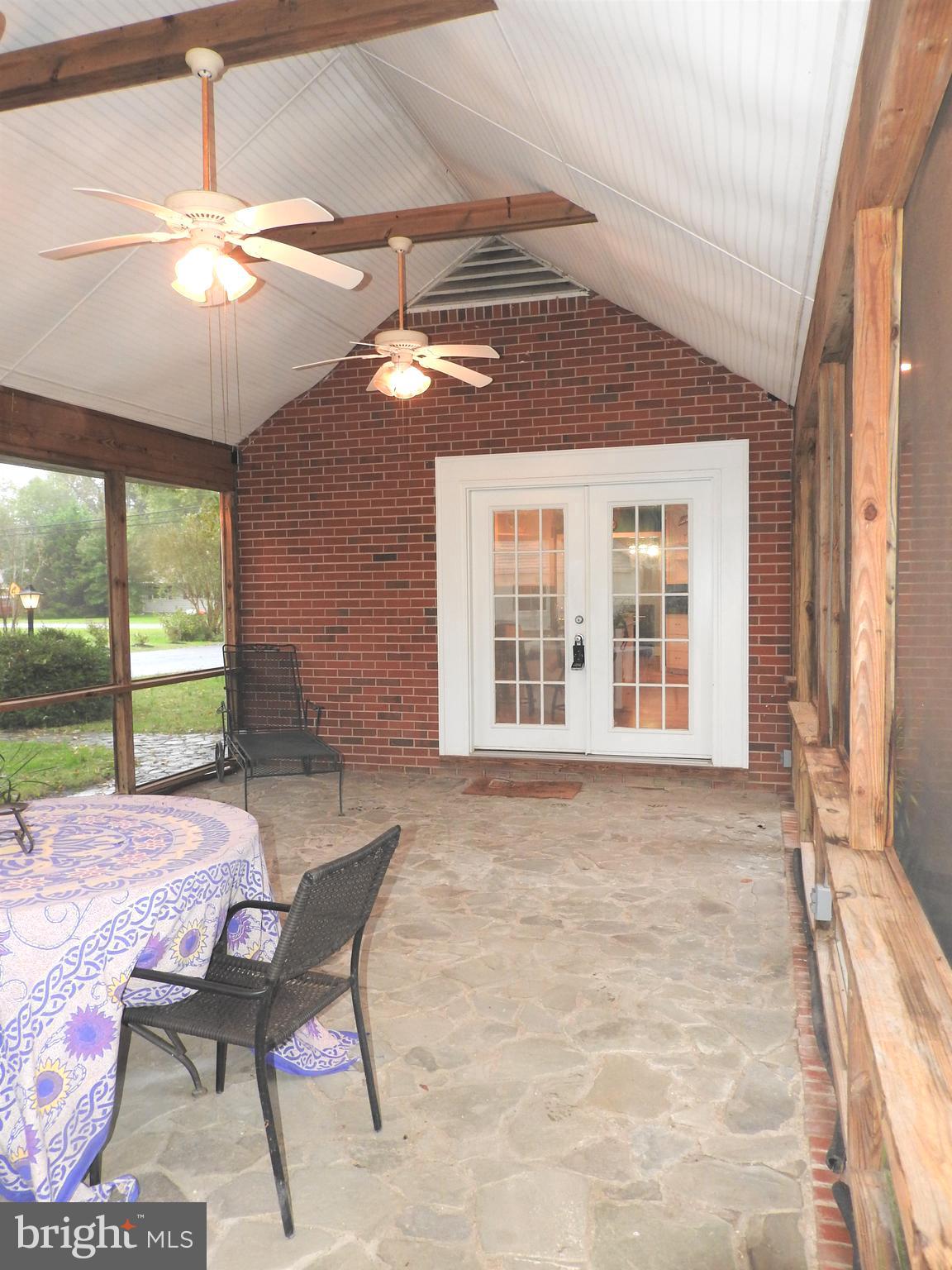 101 Sandy Hill Road Cambridge, MD 21613 - Photo 4 of 53 Screened porch leads to kitchen