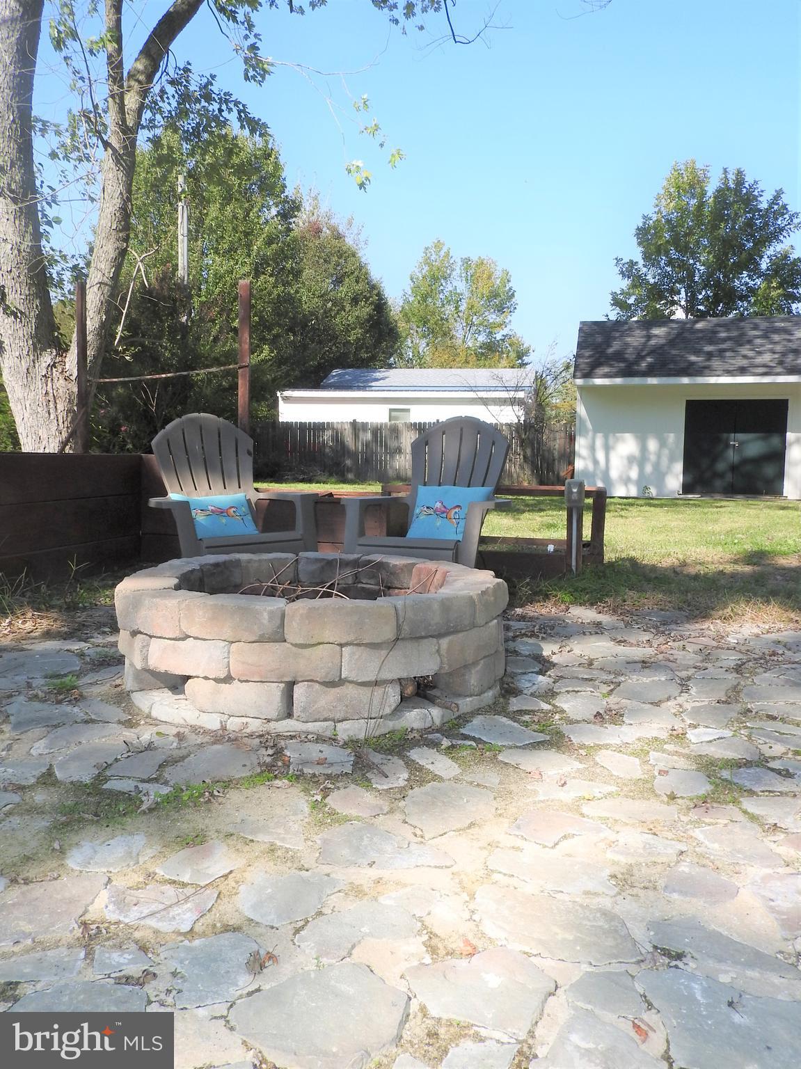 101 Sandy Hill Road Cambridge, MD 21613 - Photo 7 of 53 Large back yard with fire pit