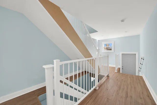 a view of entryway with wooden floor
