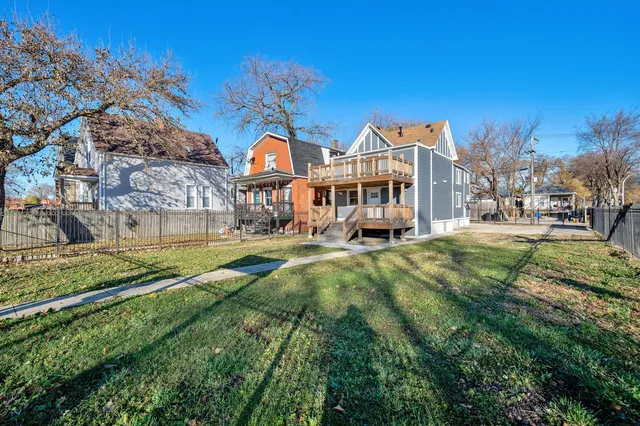 a front view of a residential apartment building with a yard