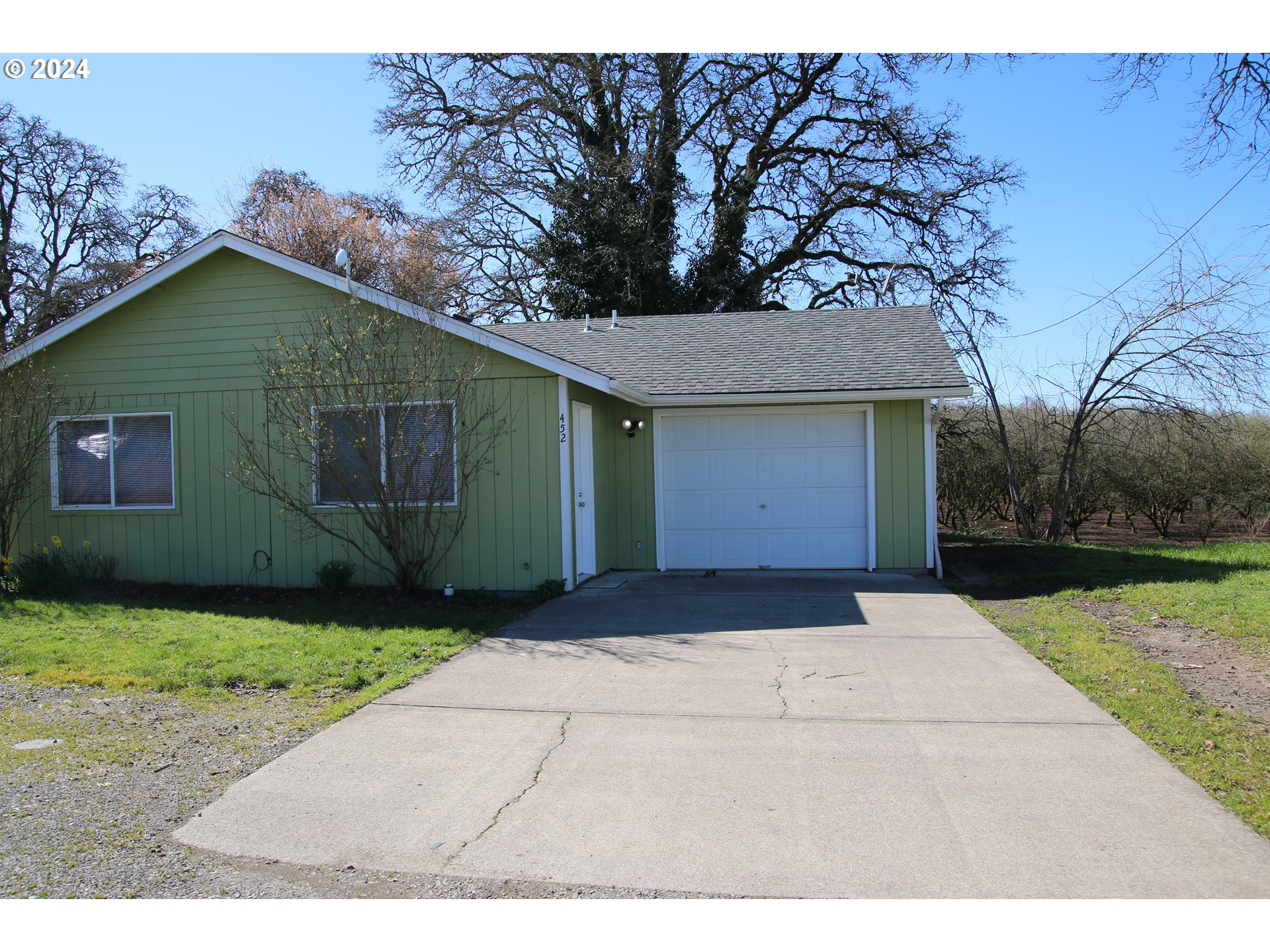 452 Olson Drive Jefferson, OR 97352 - Photo 1 of 17 a front view of a house with garden