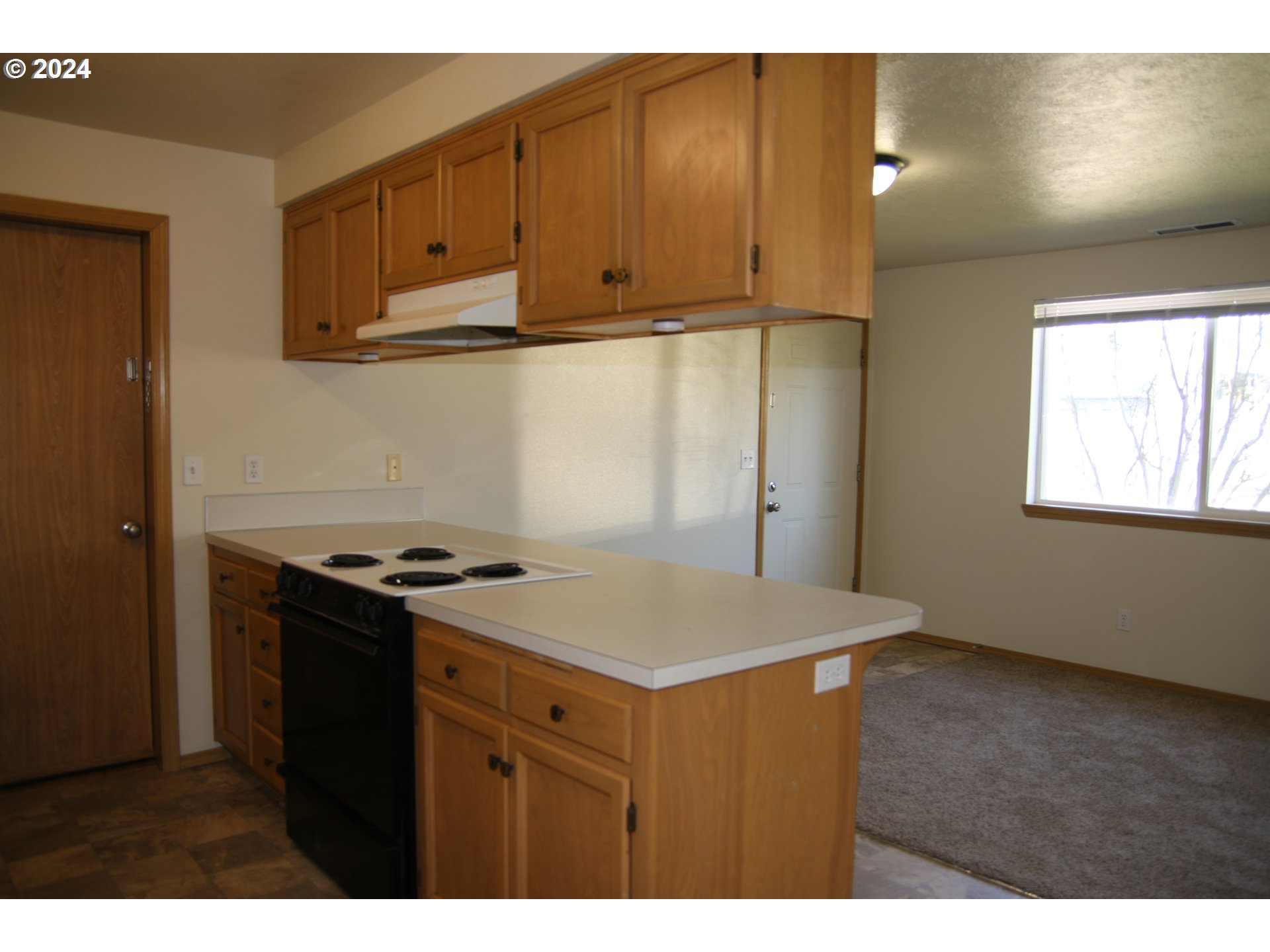 452 Olson Drive Jefferson, OR 97352 - Photo 7 of 17 a kitchen with wooden cabinets and a stove