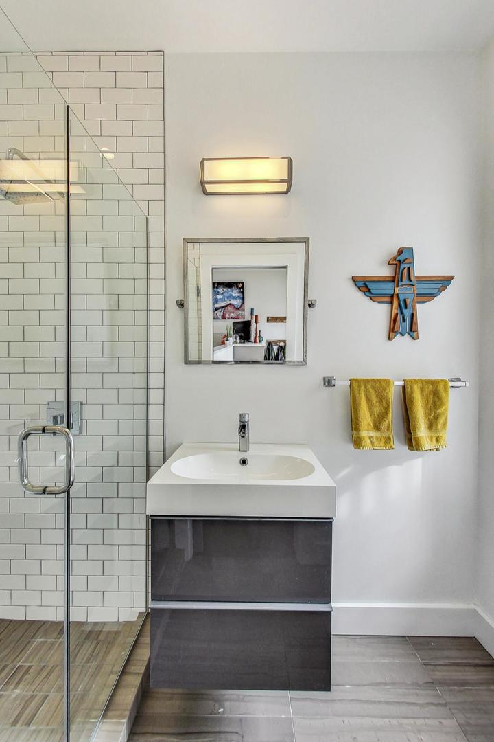 2445 West Rice Street Chicago, IL 60622 - Photo 13 of 46 a bathroom with a sink and a mirror