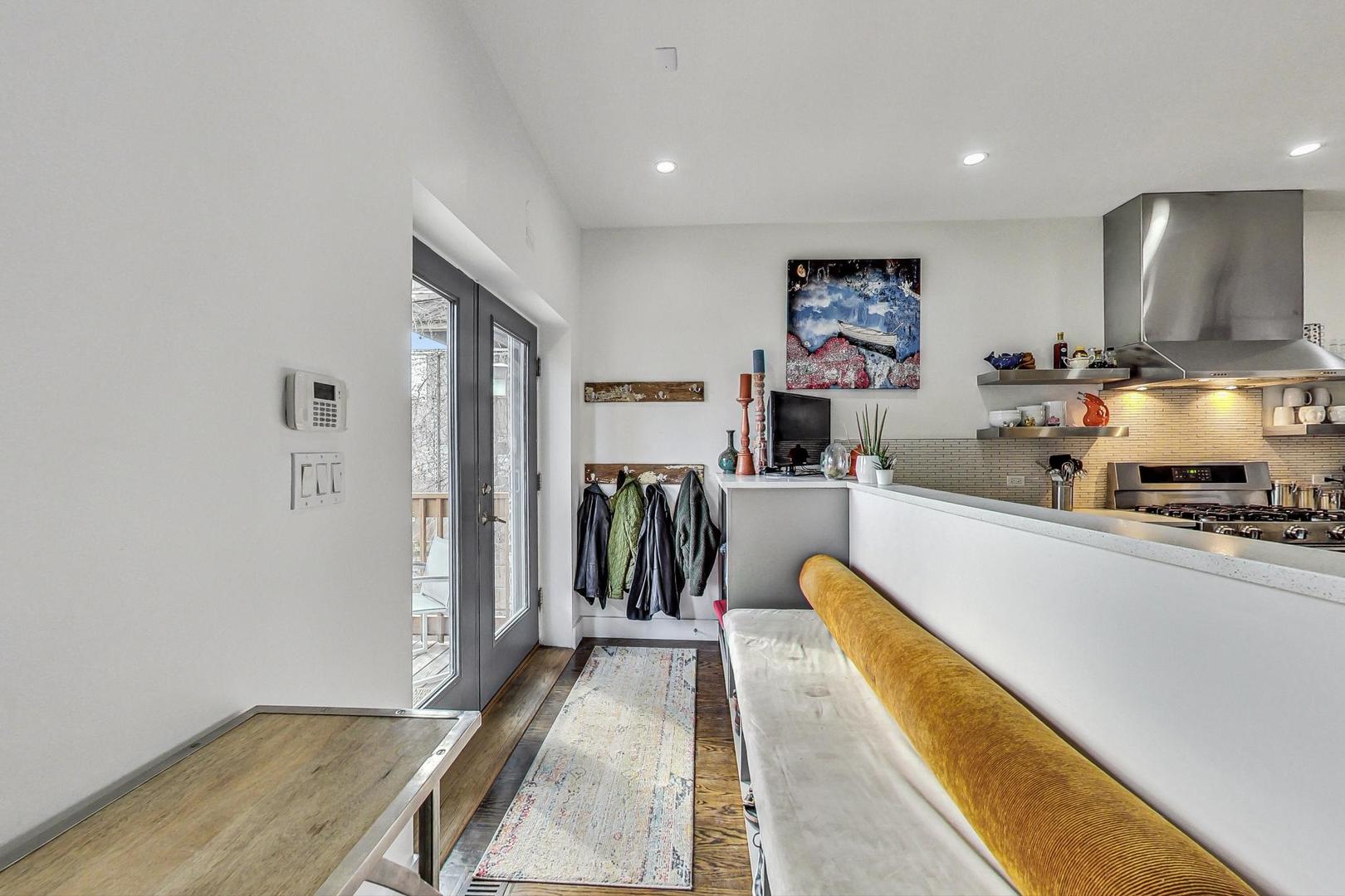 2445 West Rice Street Chicago, IL 60622 - Photo 14 of 46 a view of a living room with a flat screen tv