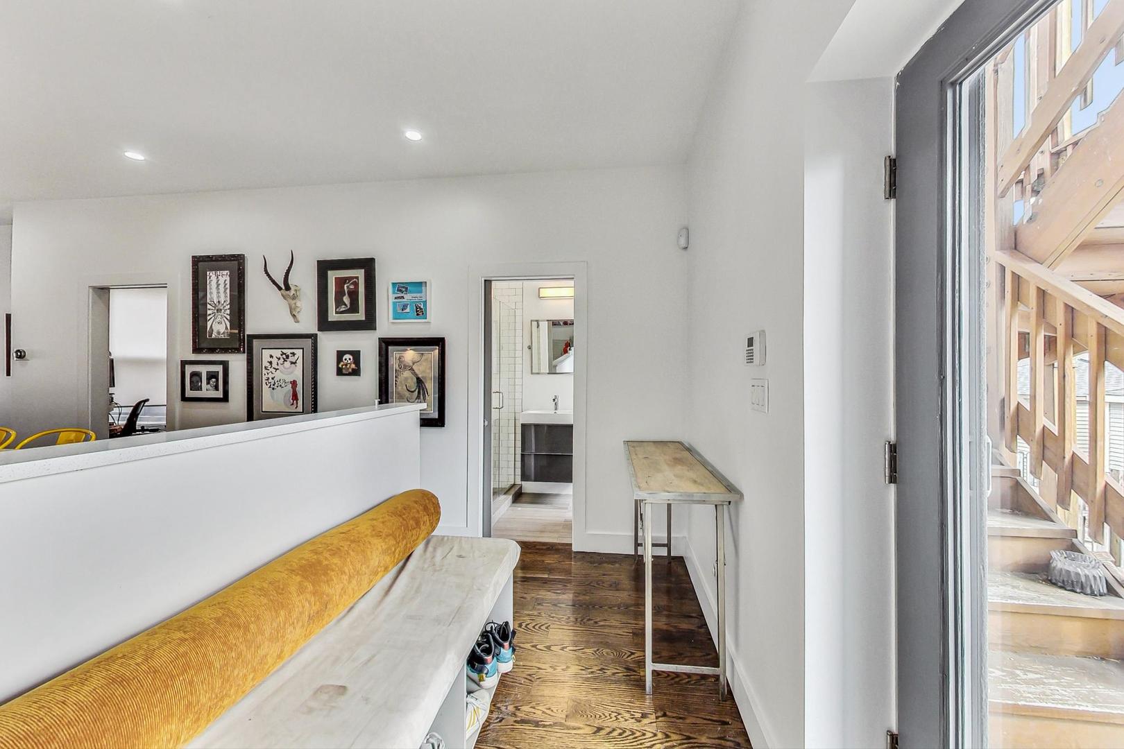 2445 West Rice Street Chicago, IL 60622 - Photo 15 of 46 a living room with furniture and a large window
