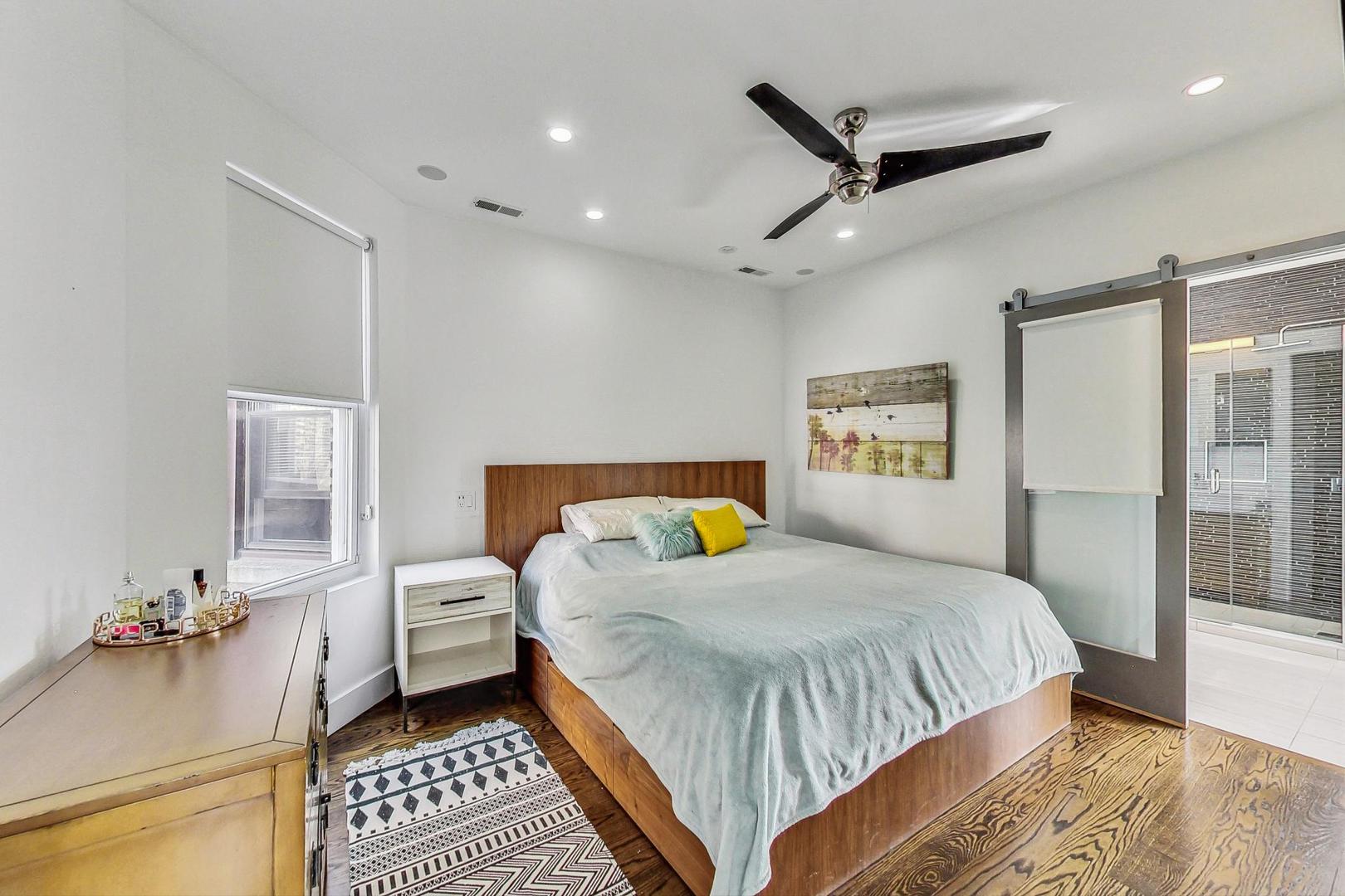 2445 West Rice Street Chicago, IL 60622 - Photo 18 of 46 a bedroom with a bed and a chandelier