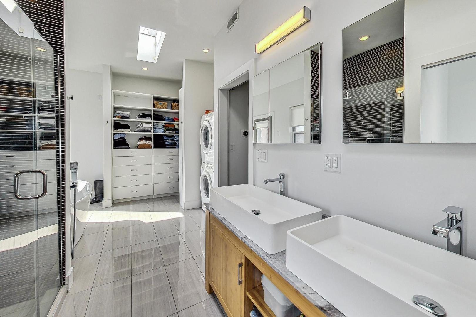 2445 West Rice Street Chicago, IL 60622 - Photo 22 of 46 a bathroom with a sink a toilet and shower