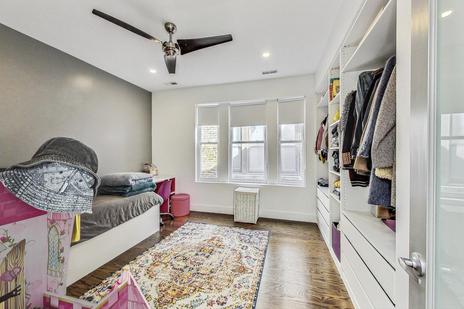 2445 West Rice Street Chicago, IL 60622 - Photo 28 of 46 a living room with furniture and a rug
