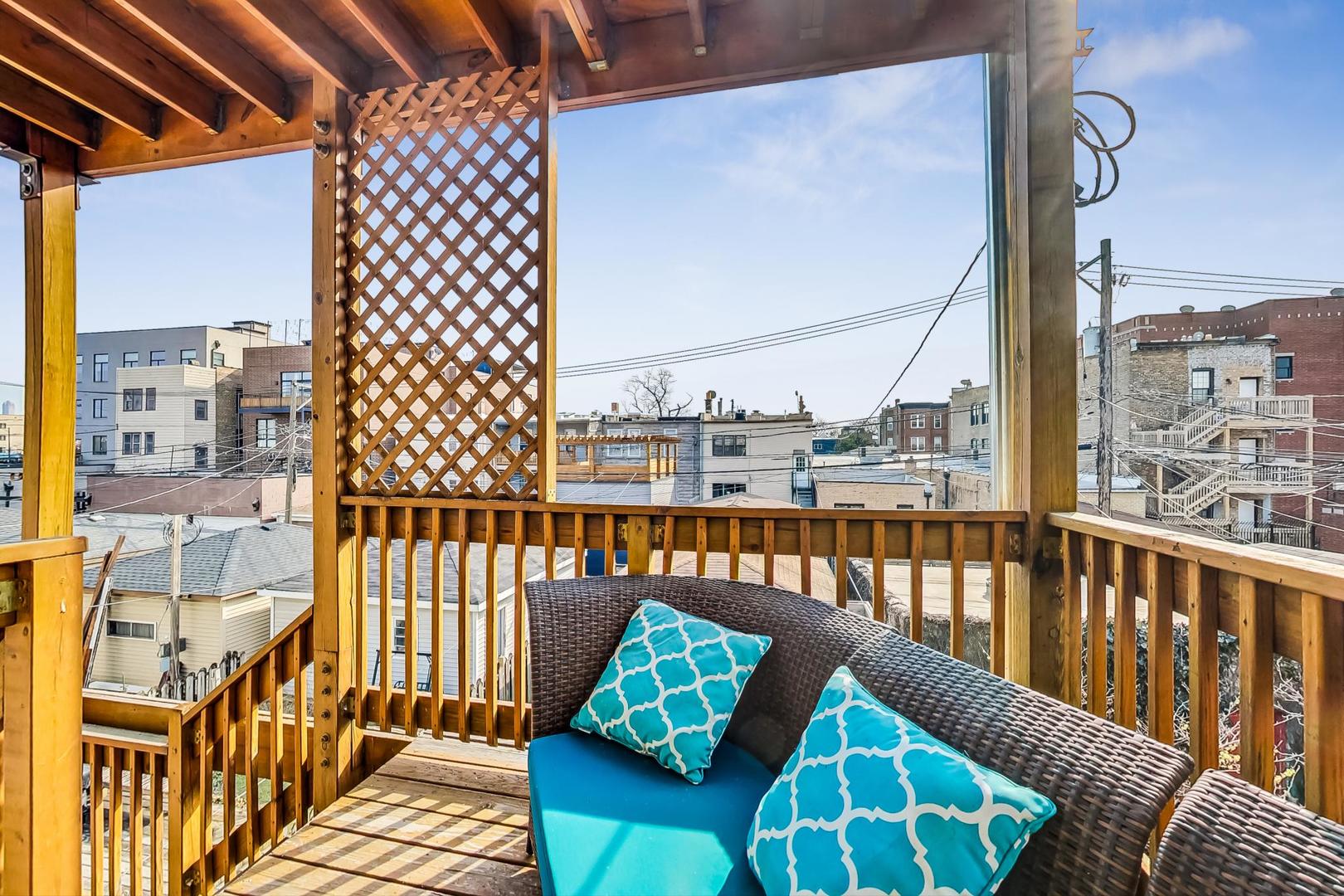 2445 West Rice Street Chicago, IL 60622 - Photo 32 of 46 a balcony with wooden floor view