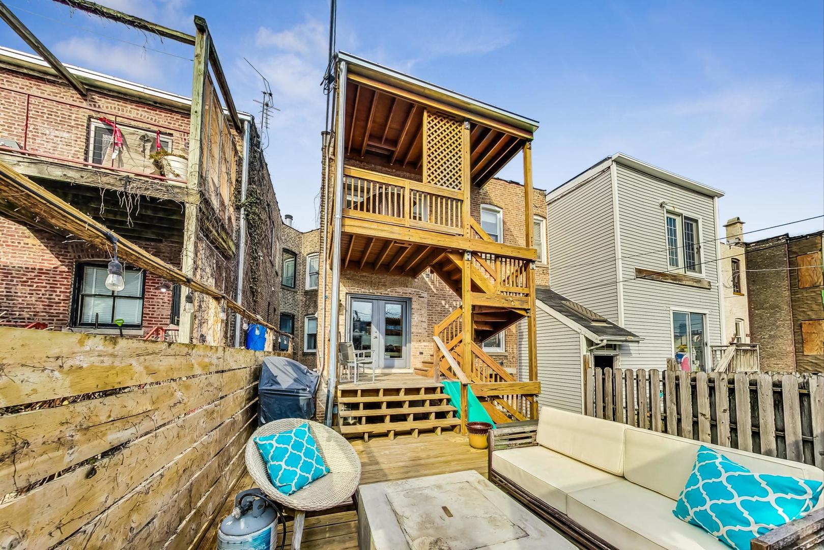 2445 West Rice Street Chicago, IL 60622 - Photo 37 of 46 a view of a chairs and table in the balcony