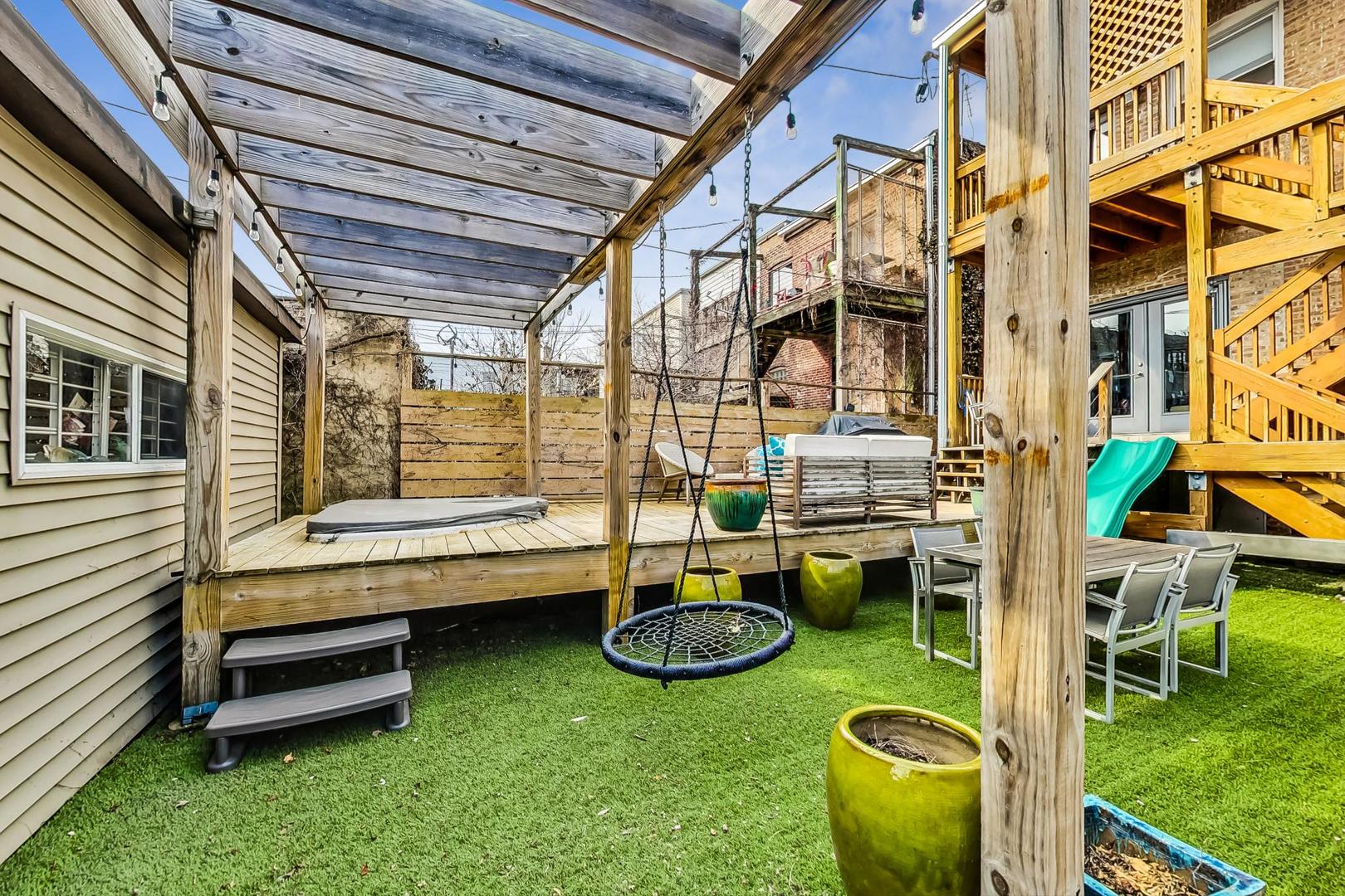 2445 West Rice Street Chicago, IL 60622 - Photo 40 of 46 a backyard of a house with outdoor seating