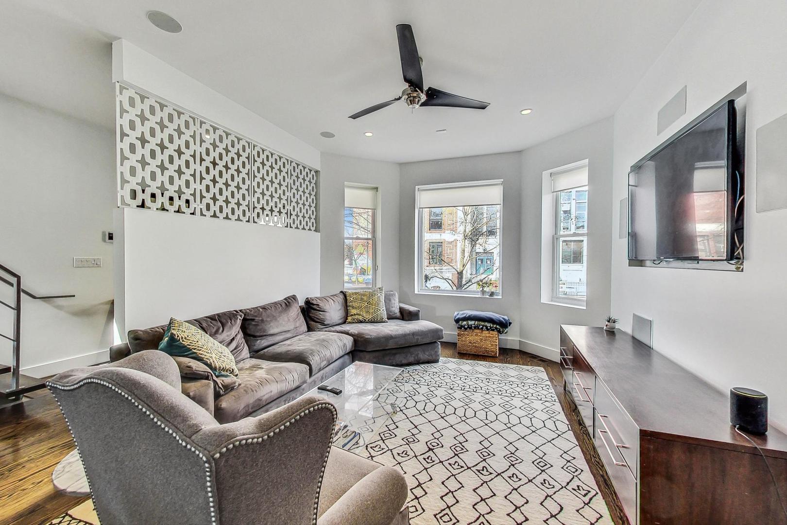 2445 West Rice Street Chicago, IL 60622 - Photo 4 of 46 a living room with furniture or couch and a window