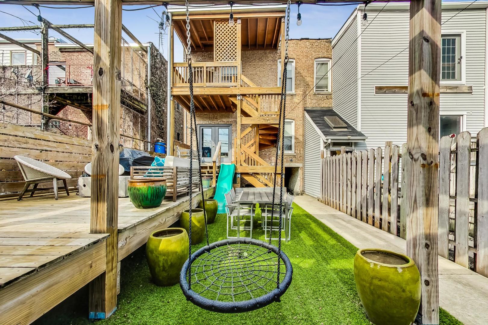 2445 West Rice Street Chicago, IL 60622 - Photo 41 of 46 a view of a chair and tables in the balcony