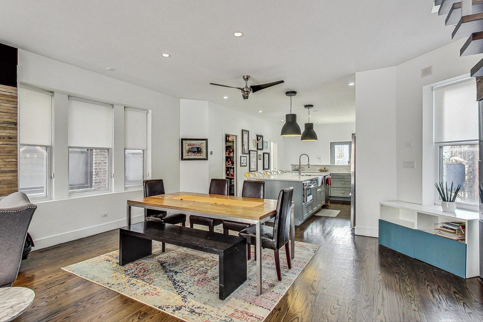 2445 West Rice Street Chicago, IL 60622 - Photo 7 of 46 a living room with furniture a wooden floor and a table