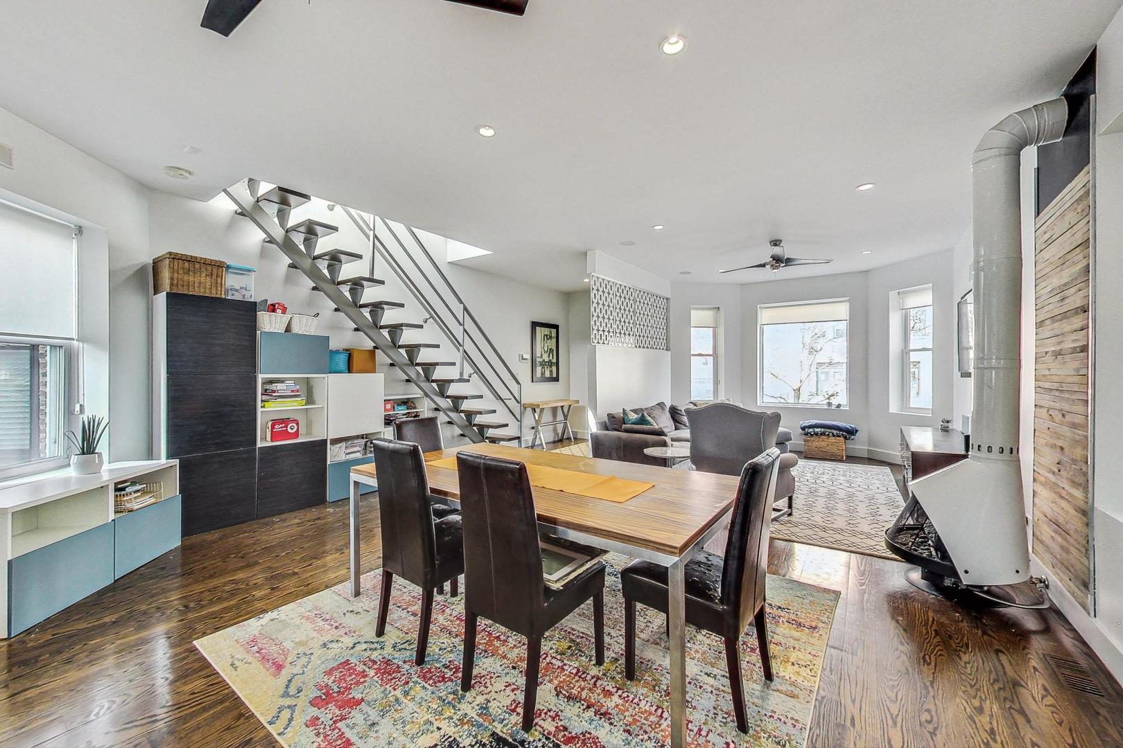 2445 West Rice Street Chicago, IL 60622 - Photo 8 of 46 a view of a dining room with furniture and wooden floor