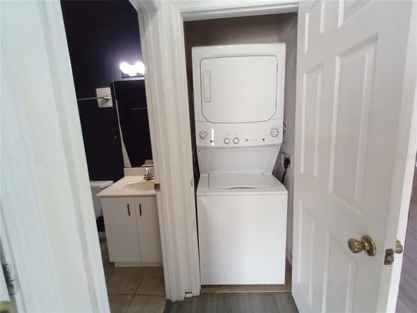 a roof deck with couches and wooden floor