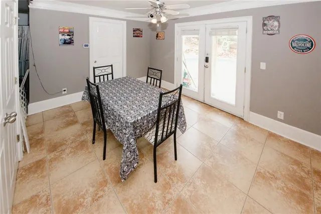 a view of a dining room with furniture and chandelier