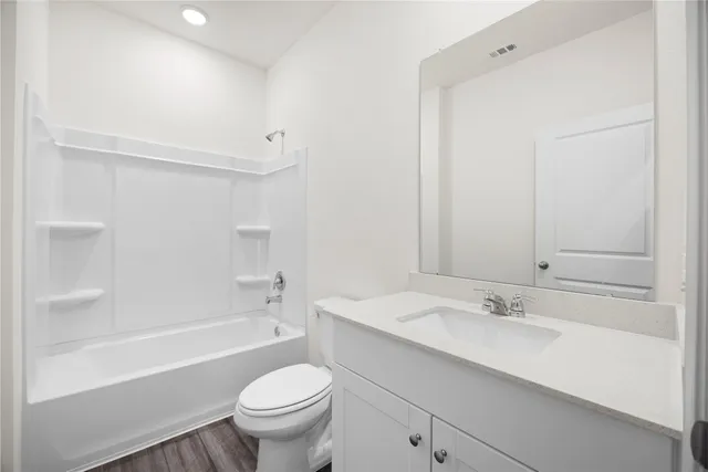 a bathroom with a sink a toilet and a bathtub