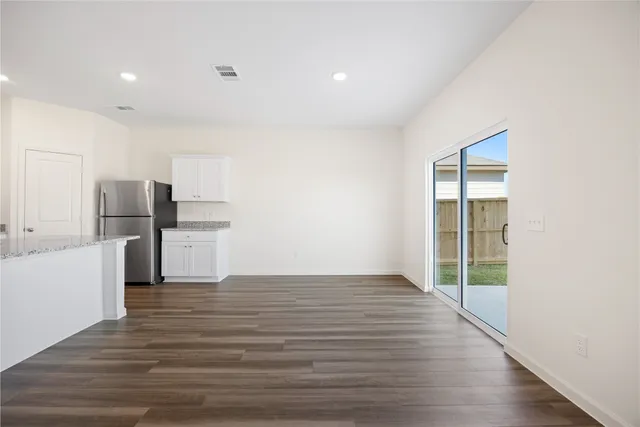 a view of kitchen with wooden floor