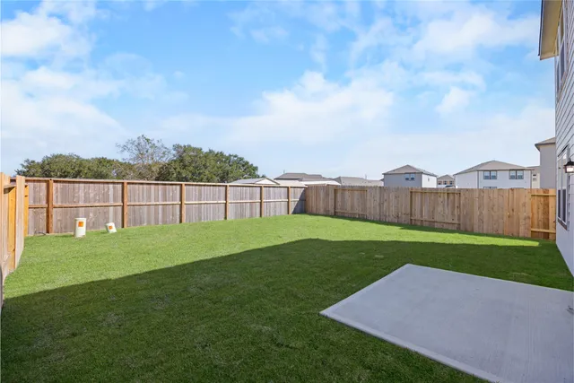 a view of backyard with green space