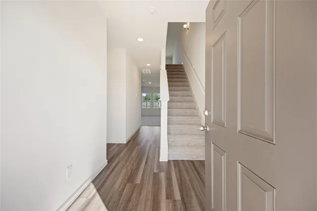 a view of entryway with wooden floor