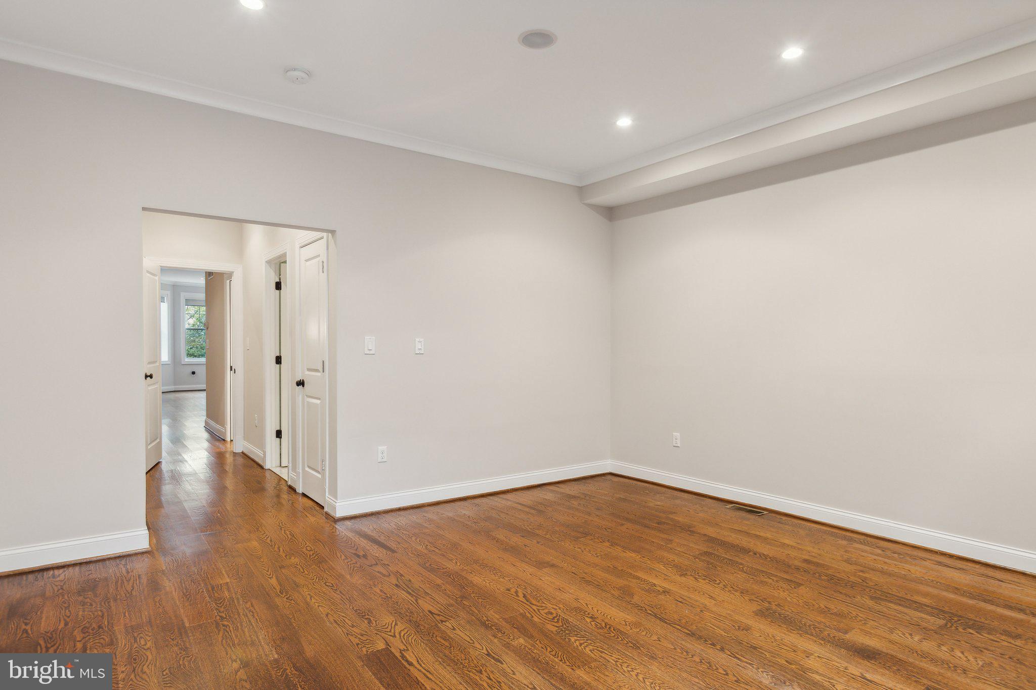 39 U Street Northeast, Unit 1 Washington, DC 20002 - Photo 7 of 22 wooden floor in an empty room