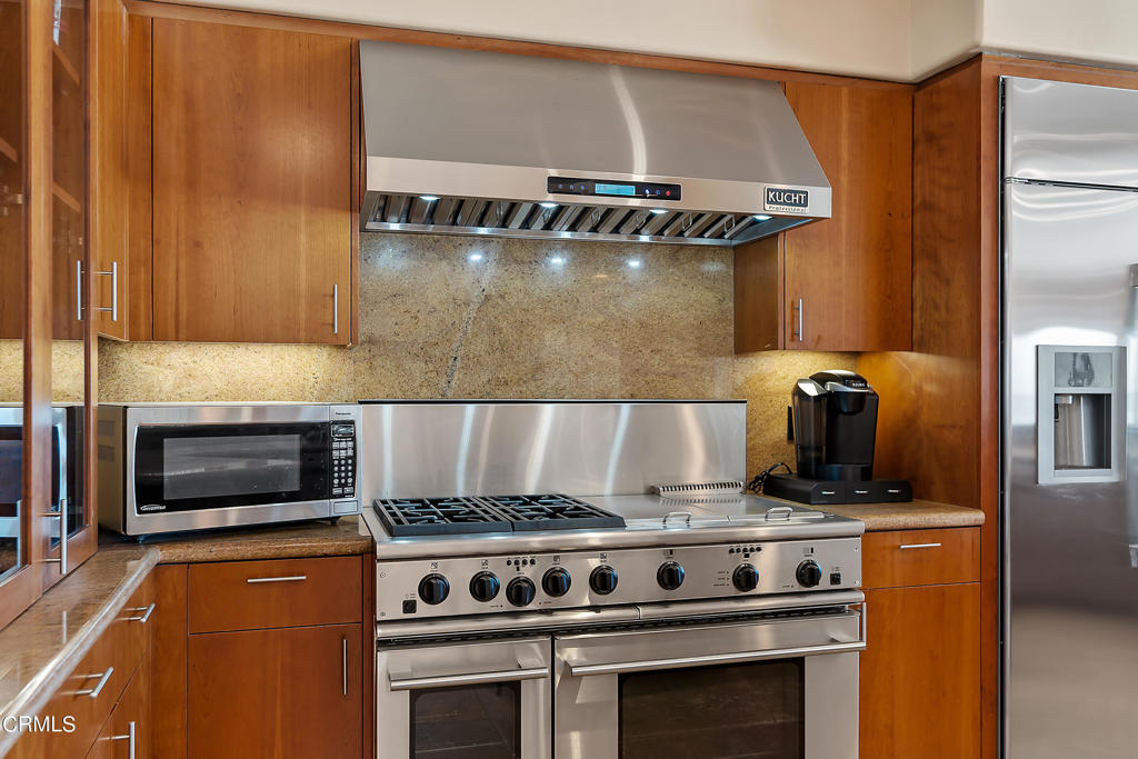 791 Mandalay Beach Road Oxnard, CA 93035 - Photo 20 of 46 a stove top oven sitting inside of a kitchen