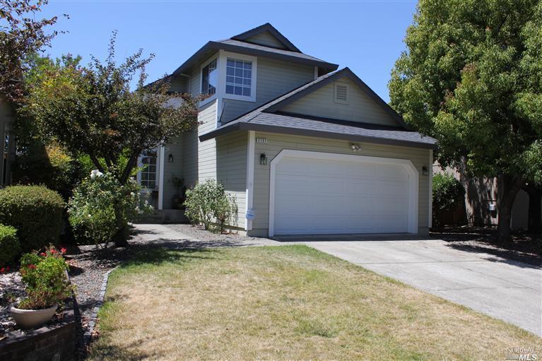 2151 Bock Street Santa Rosa, CA 95403 - Photo 1 of 1 a front view of a house with a yard and garage