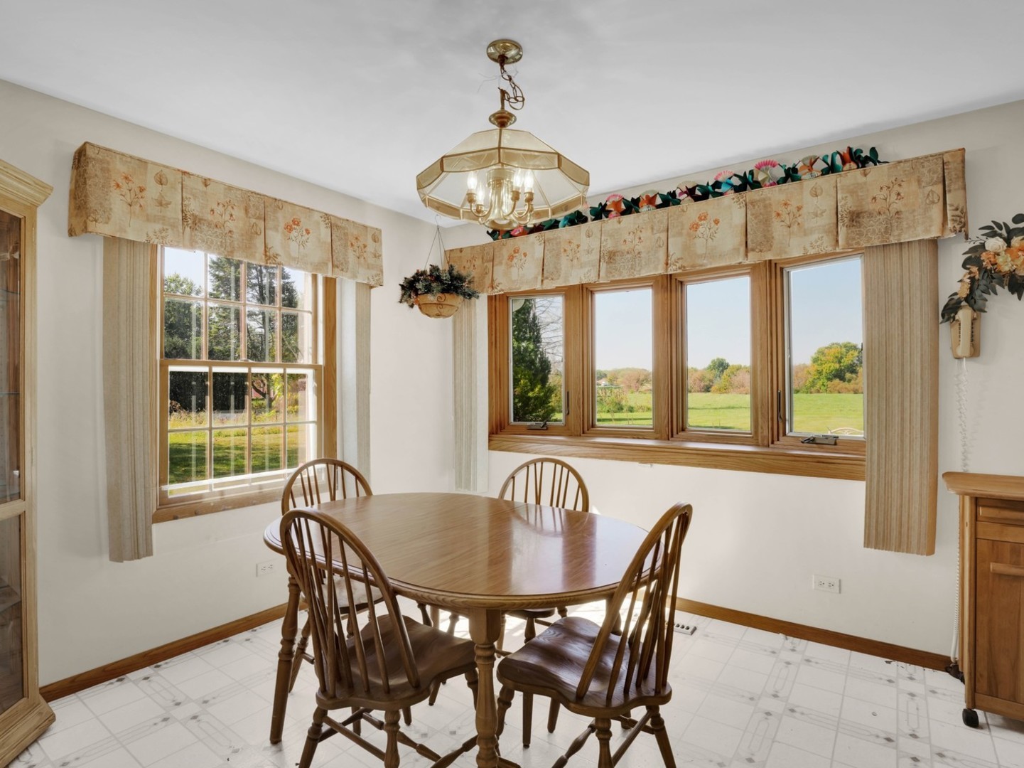 3303 Vermont Road Woodstock, IL 60098 - Photo 11 of 68 a view of a dining room with furniture window and outside view