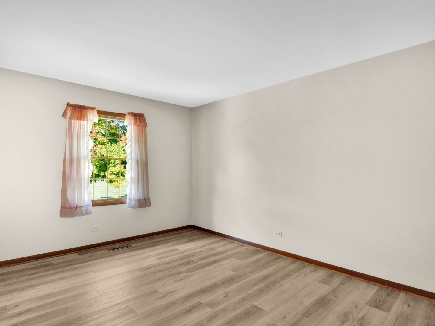 3303 Vermont Road Woodstock, IL 60098 - Photo 16 of 68 an empty room with wooden floor and windows