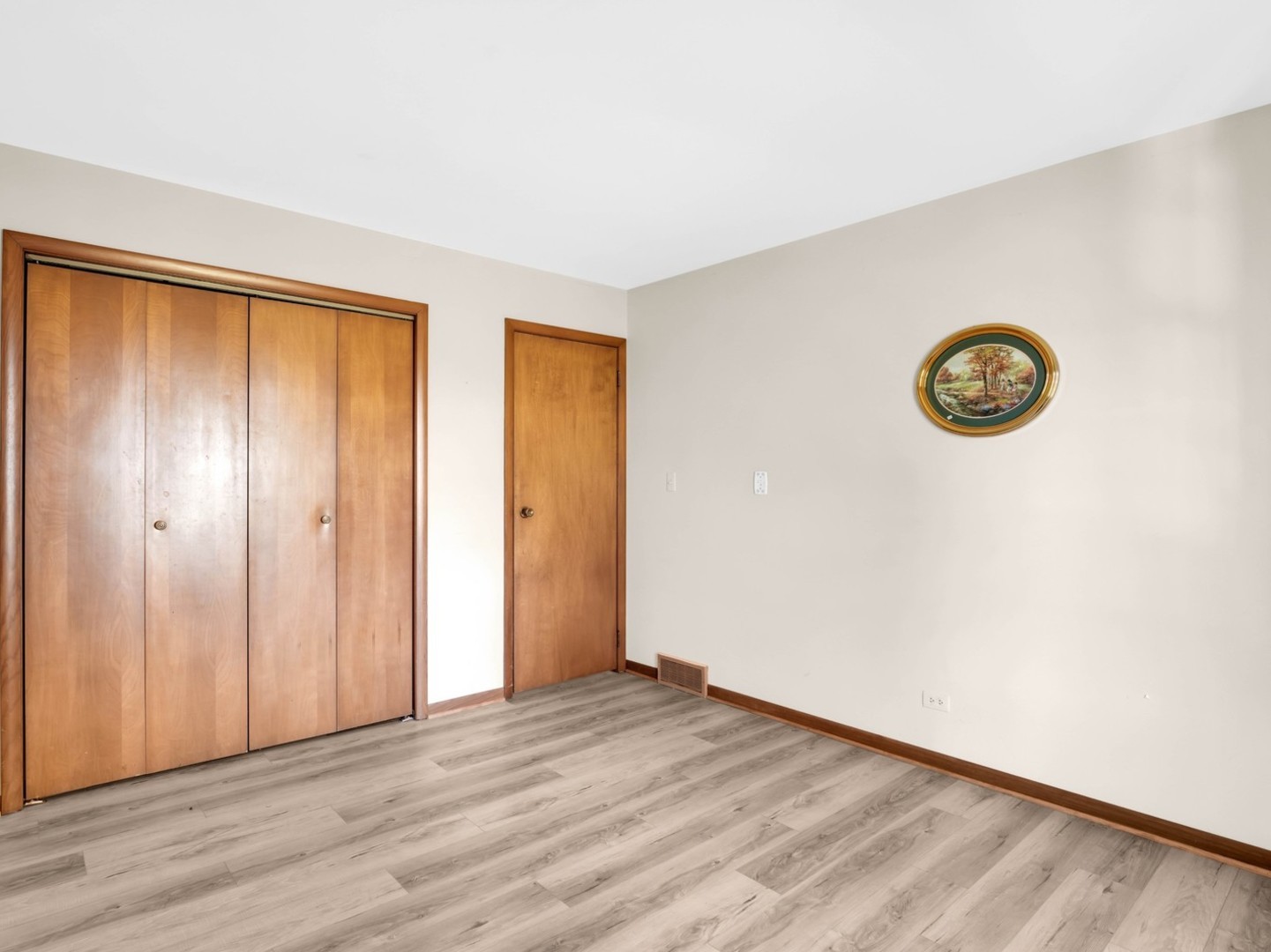 3303 Vermont Road Woodstock, IL 60098 - Photo 17 of 68 a view of an empty room with wooden floor