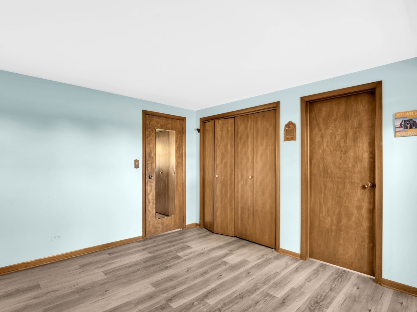 3303 Vermont Road Woodstock, IL 60098 - Photo 22 of 68 a view of an empty room with wooden floor and closet