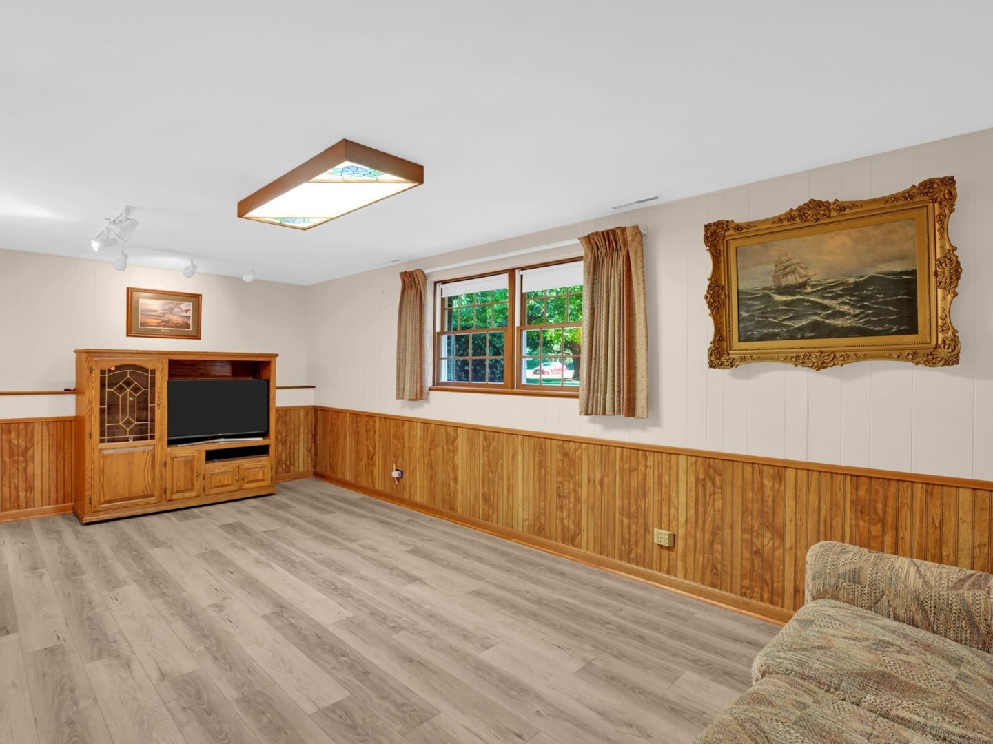 3303 Vermont Road Woodstock, IL 60098 - Photo 23 of 68 a view of a kitchen with furniture and a flat screen tv