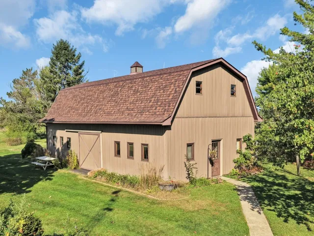 a backyard of a house with lots of green space