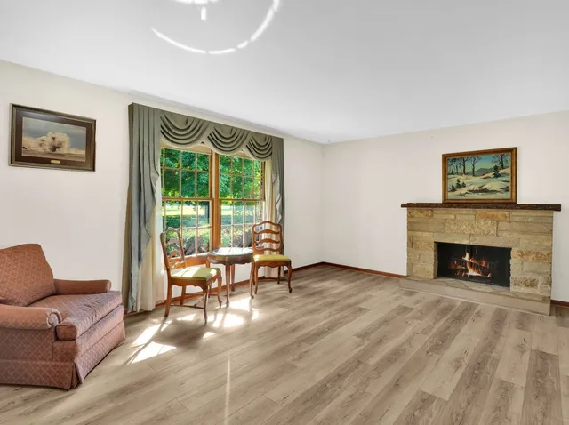 a living room with couches and a fireplace