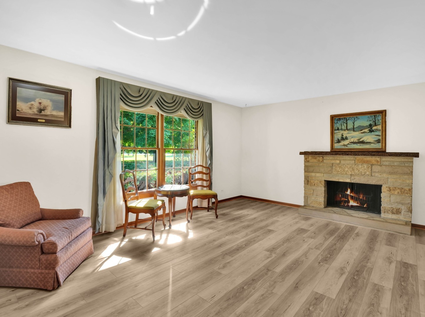 3303 Vermont Road Woodstock, IL 60098 - Photo 5 of 68 a living room with furniture and a fireplace