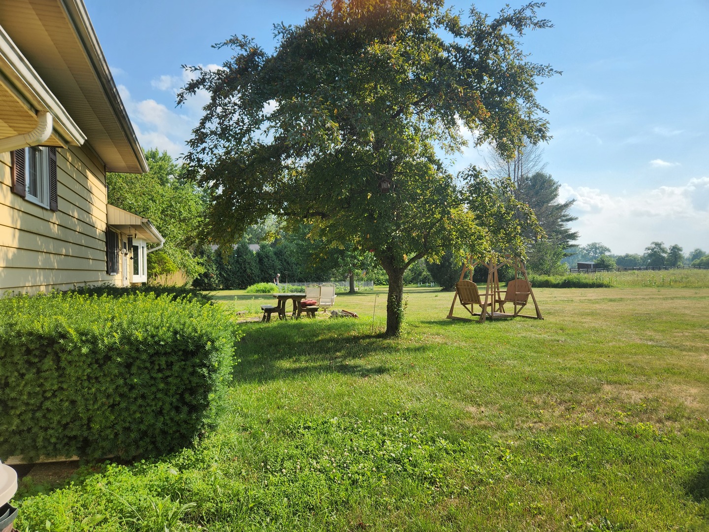 3303 Vermont Road Woodstock, IL 60098 - Photo 59 of 68 a view of a yard with a house