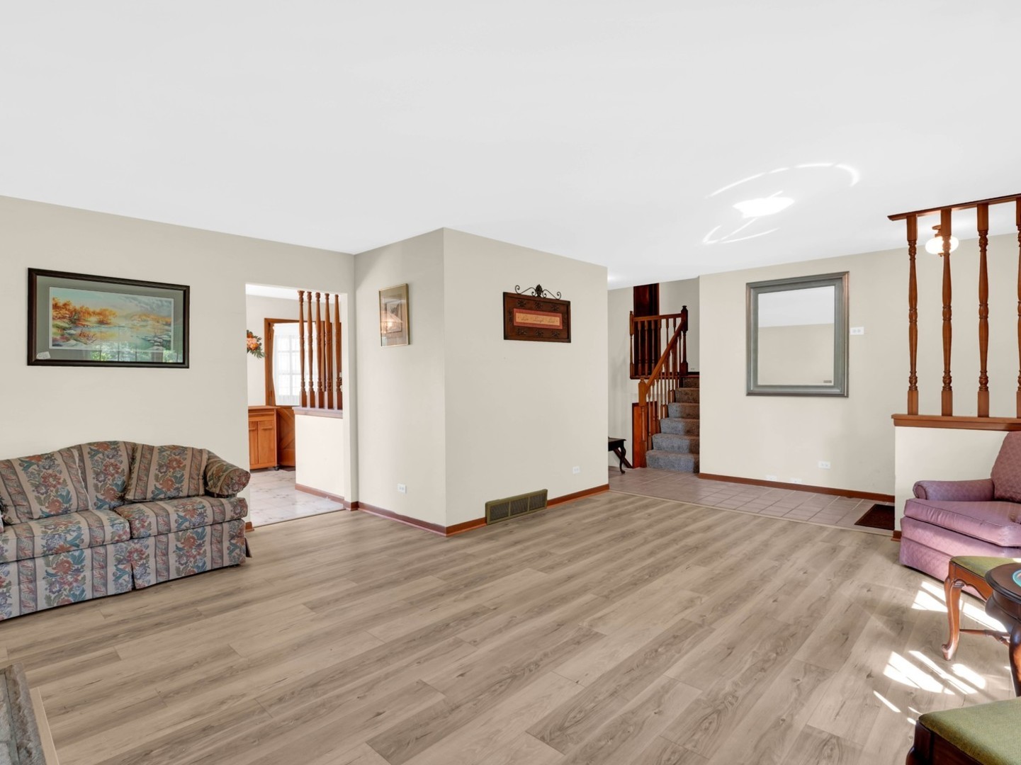 3303 Vermont Road Woodstock, IL 60098 - Photo 7 of 68 a living room with furniture and a wooden floor